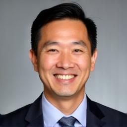 Professional headshot of David Tan.